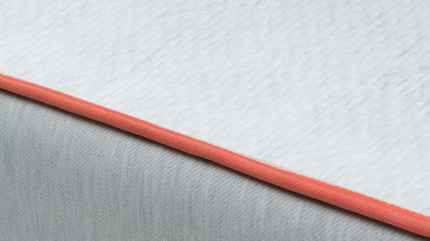 Bear Cub mattress Tencel cover edge detail in salmon color