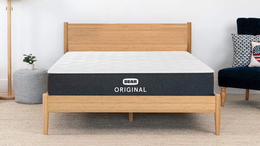 Bear Original Mattress – the mattress on a wooden bed frame with 'The Strategist' 2025 Best in Class badge in a bedroom setting.