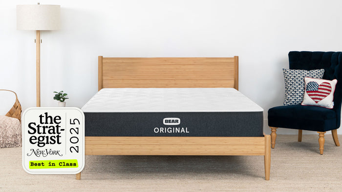 Bear mattress on a wooden bed frame with 'The Strategist' 2025 Best in Class award sign.