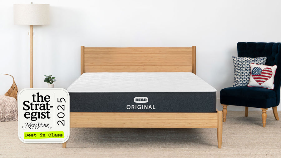 Bear mattress on a wooden bed frame with 'The Strategist' 2025 Best in Class award sign.